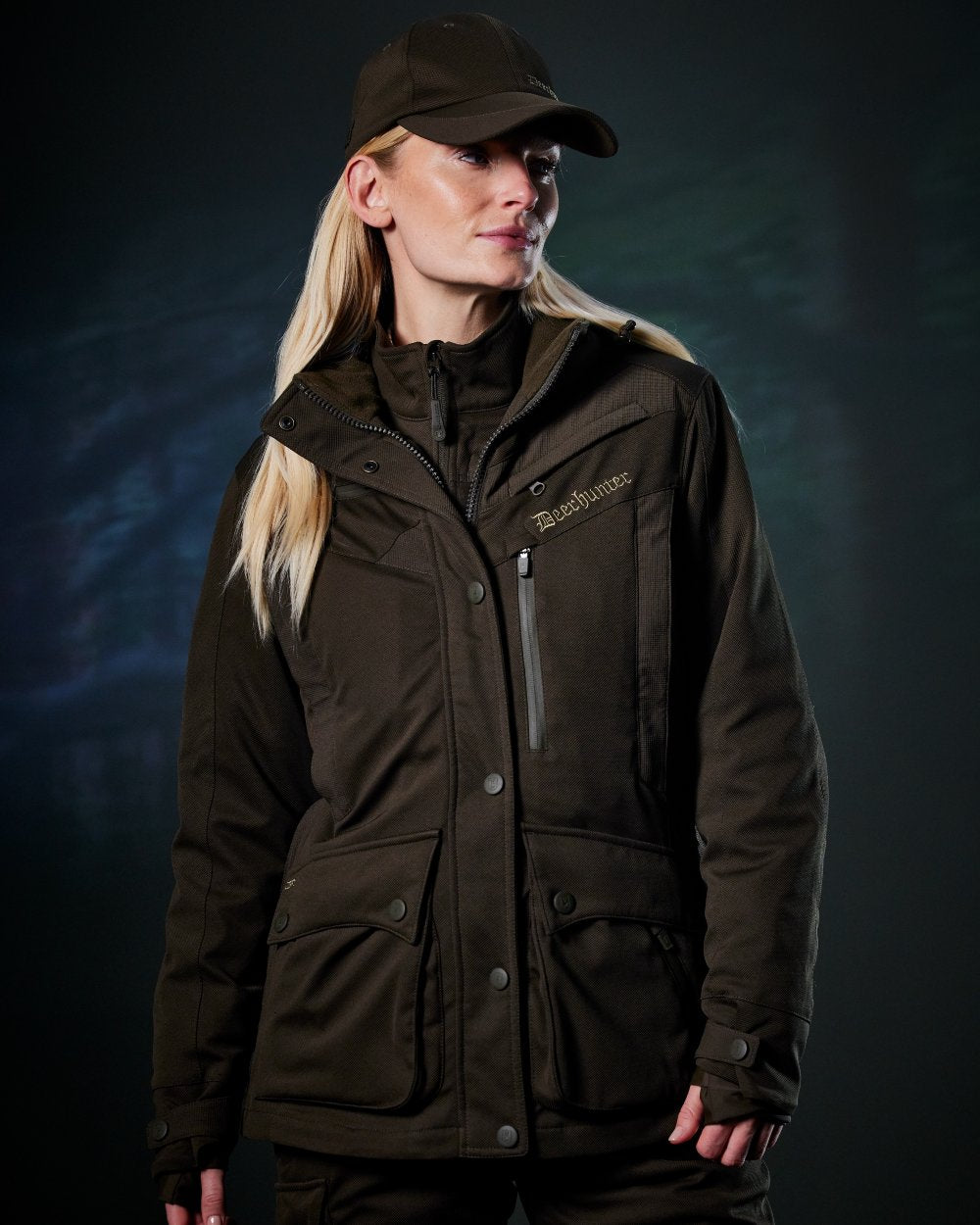 Art Green coloured Deerhunter Lady Muflon Pro Jacket on forest background #colour_art-green