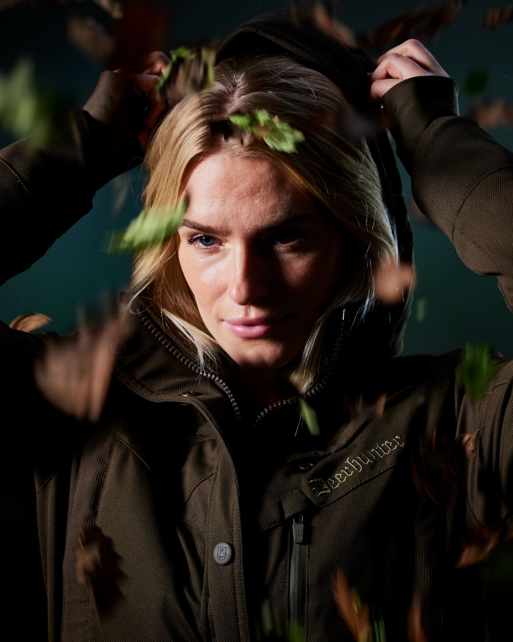 Art Green coloured Deerhunter Lady Muflon Pro Jacket on forest background #colour_art-green