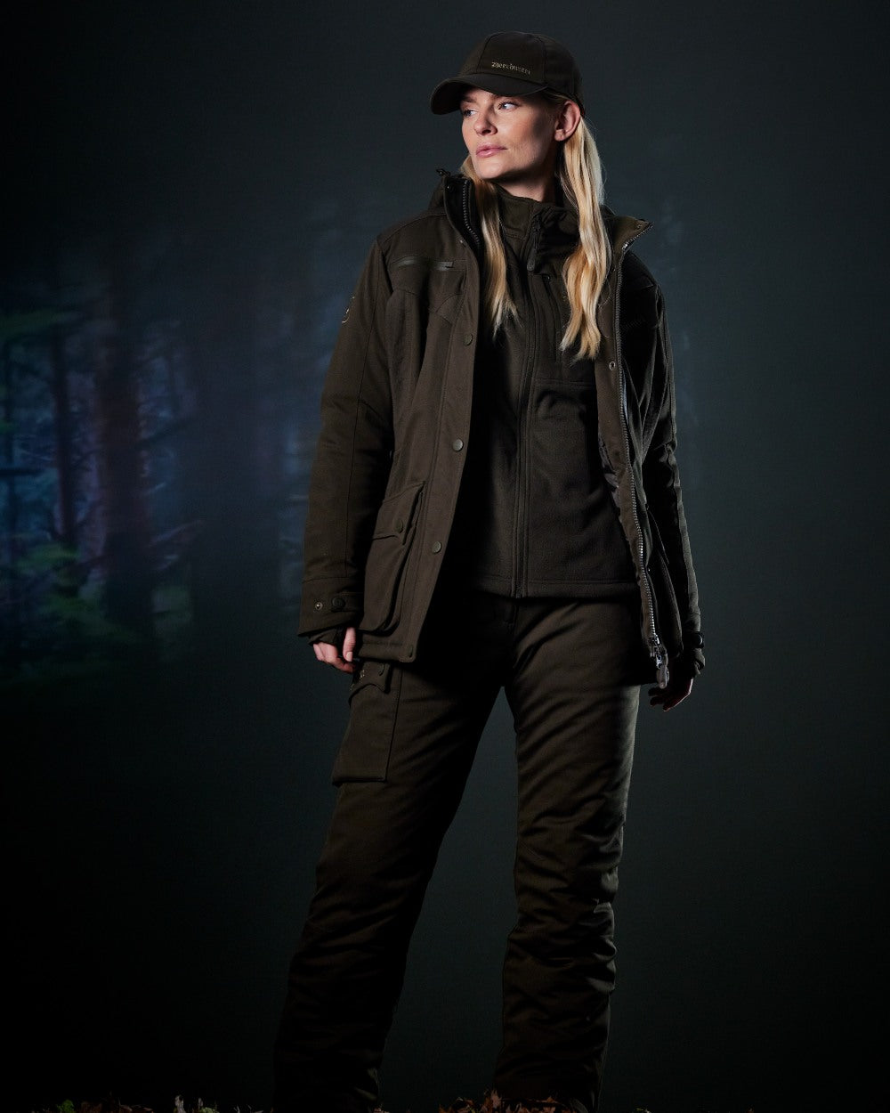 Art Green coloured Deerhunter Lady Muflon Pro Winter Jacket on forest background #colour_art-green