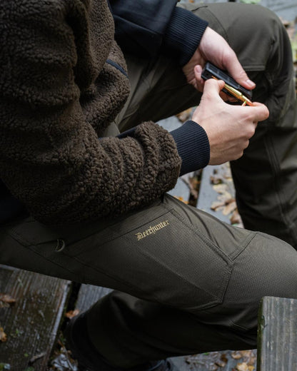 Bark Green coloured Northward Trousers on land background #colour_bark-green