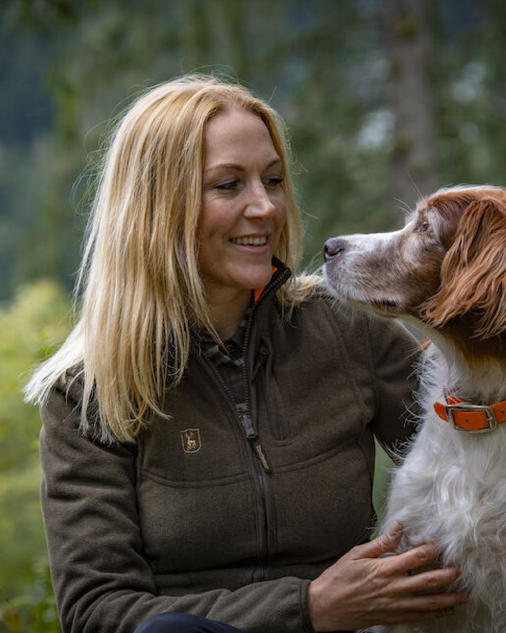Green Orange coloured Deerhunter Lady Pam Reversible Bonded Fleece Jacket on forest background #colour_green-orange
