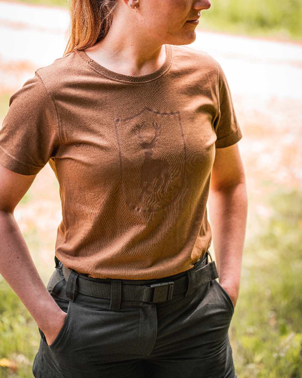 Timber coloured Deerhunter Lady Slogen Zip-Off Trousers on blurry background #colour_timber