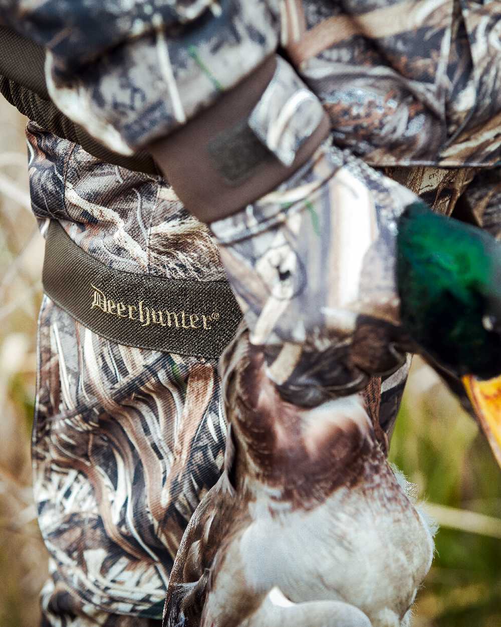 Realtree Max-5 coloured Deerhunter Mallard Trousers on blurry background #colour_realtree-max-5