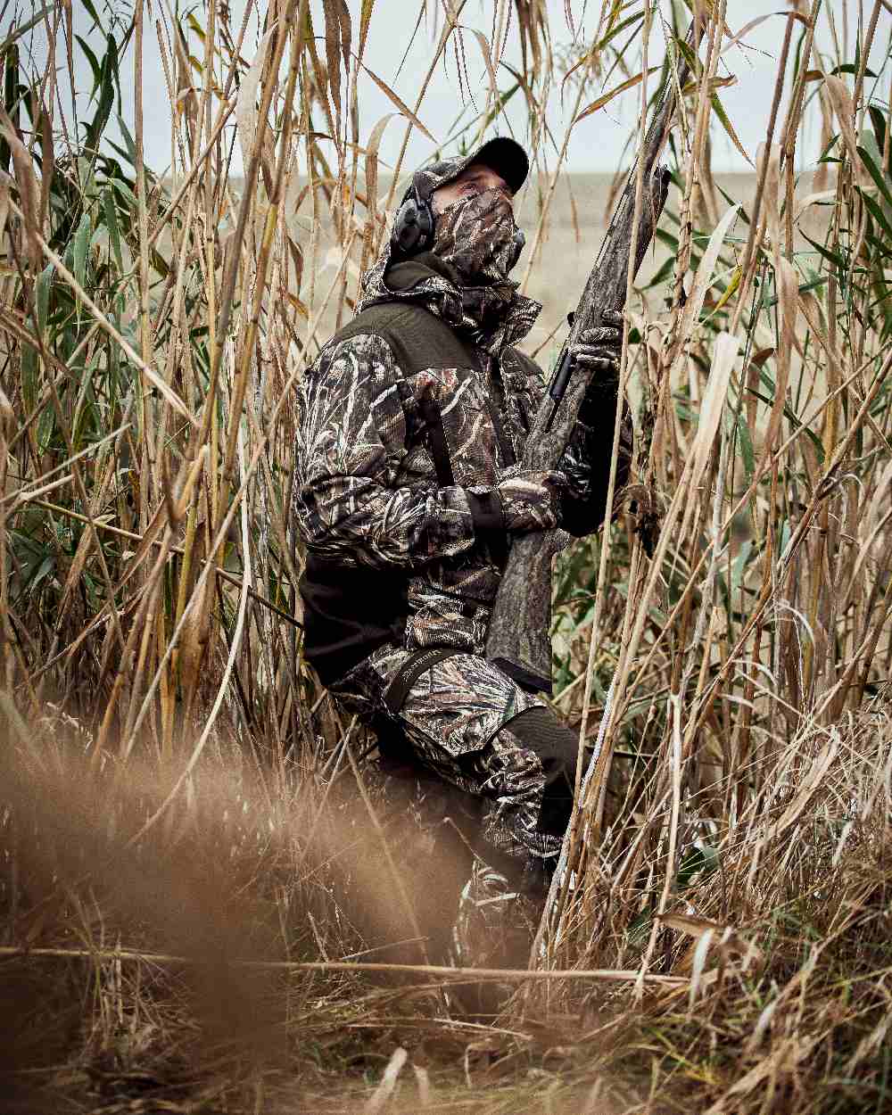 Realtree Max-5 coloured Deerhunter Mallard Trousers on grassy background #colour_realtree-max-5