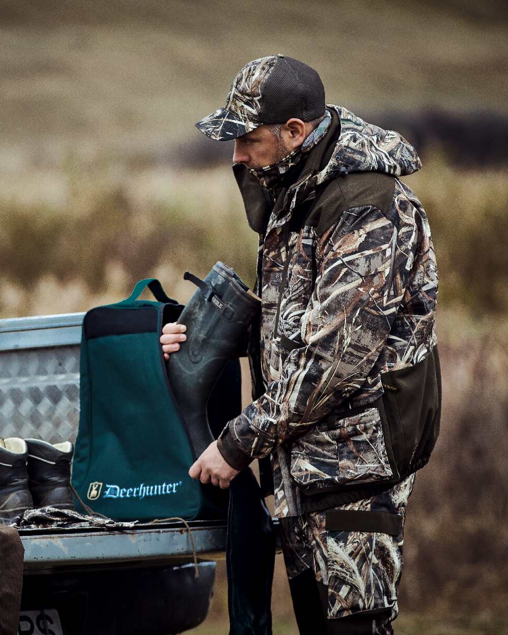 Realtree Max-5 coloured Deerhunter Mallard Trousers on blurry background #colour_realtree-max-5