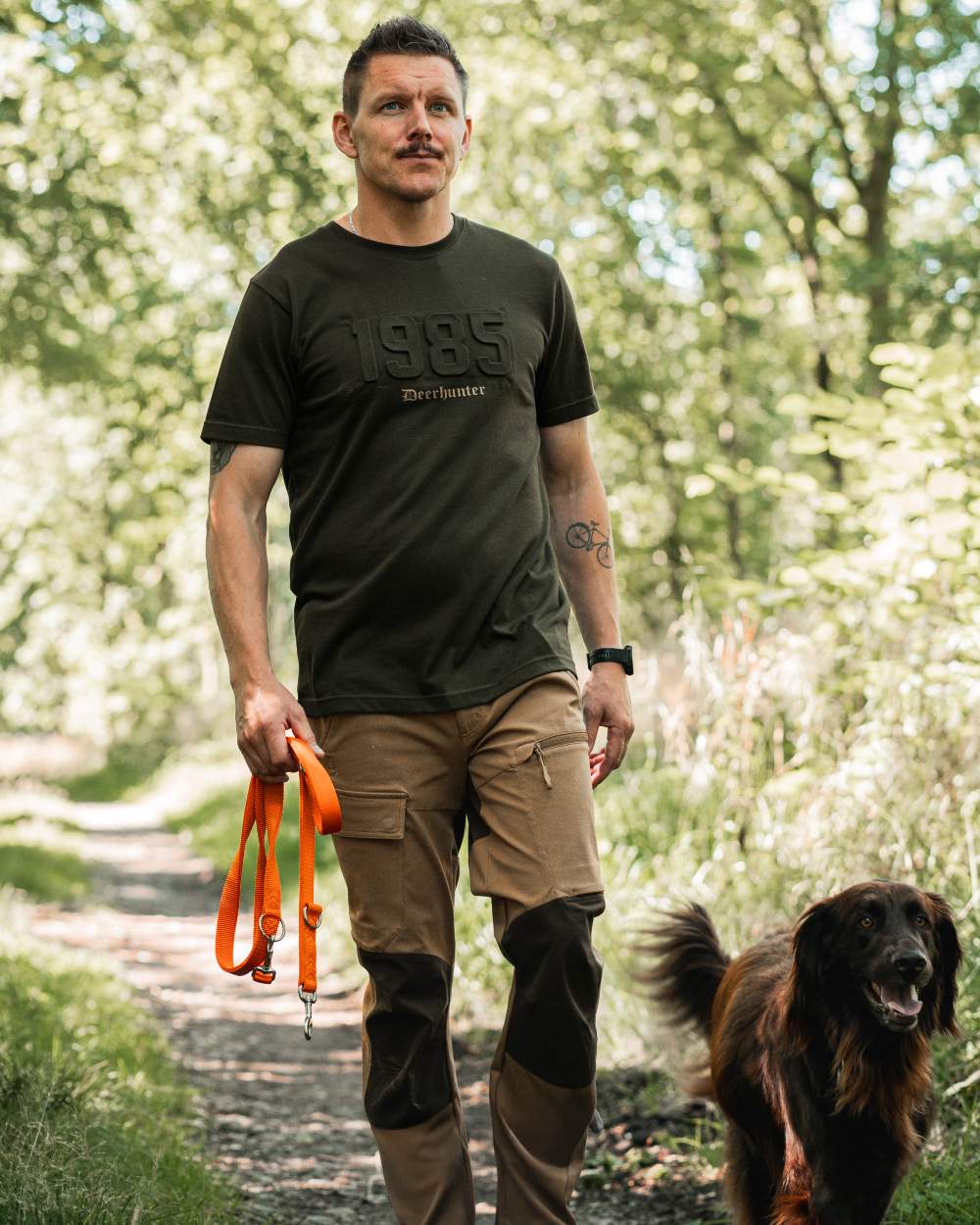 Timber coloured Deerhunter Mens Jubilee T-Shirt on forest background #colour_timber