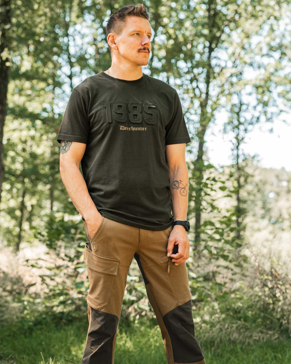 Timber coloured Deerhunter Mens Jubilee T-Shirt on forest background #colour_timber