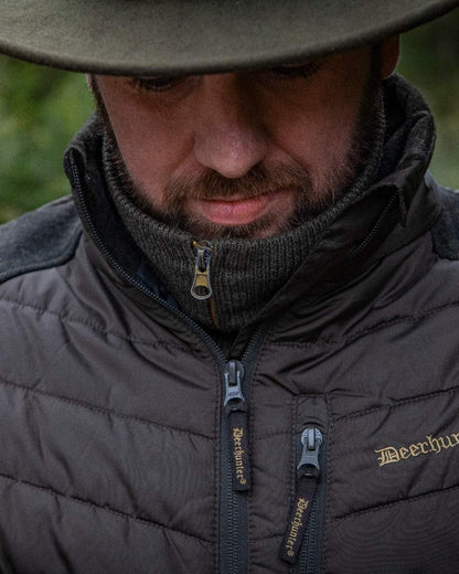 Brown Leaf Coloured Deerhunter Moor Padded Jacket with Knitted Sleeves on blurry background #colour_brown-leaf