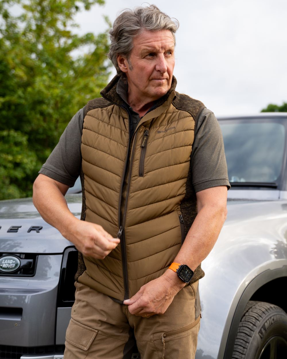 Butternut coloured Deerhunter Mens Moor Padded Waistcoat on car background #colour_butternut