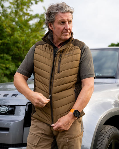 Butternut coloured Deerhunter Mens Moor Padded Waistcoat on car background #colour_butternut