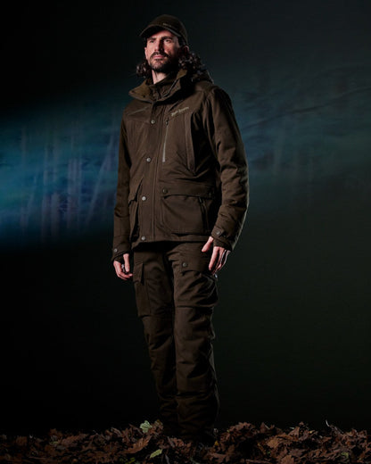 Art Green coloured Deerhunter Mens Muflon Pro Jacket on forest background #colour_art-green