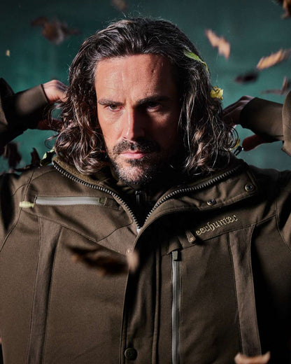 Art Green coloured Deerhunter Mens Muflon Pro Jacket on forest background #colour_art-green