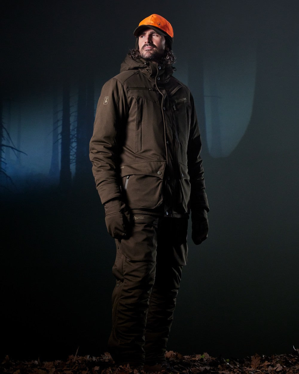 Art Green coloured Deerhunter Mens Muflon Pro Winter Jacket on forest background #colour_art-green