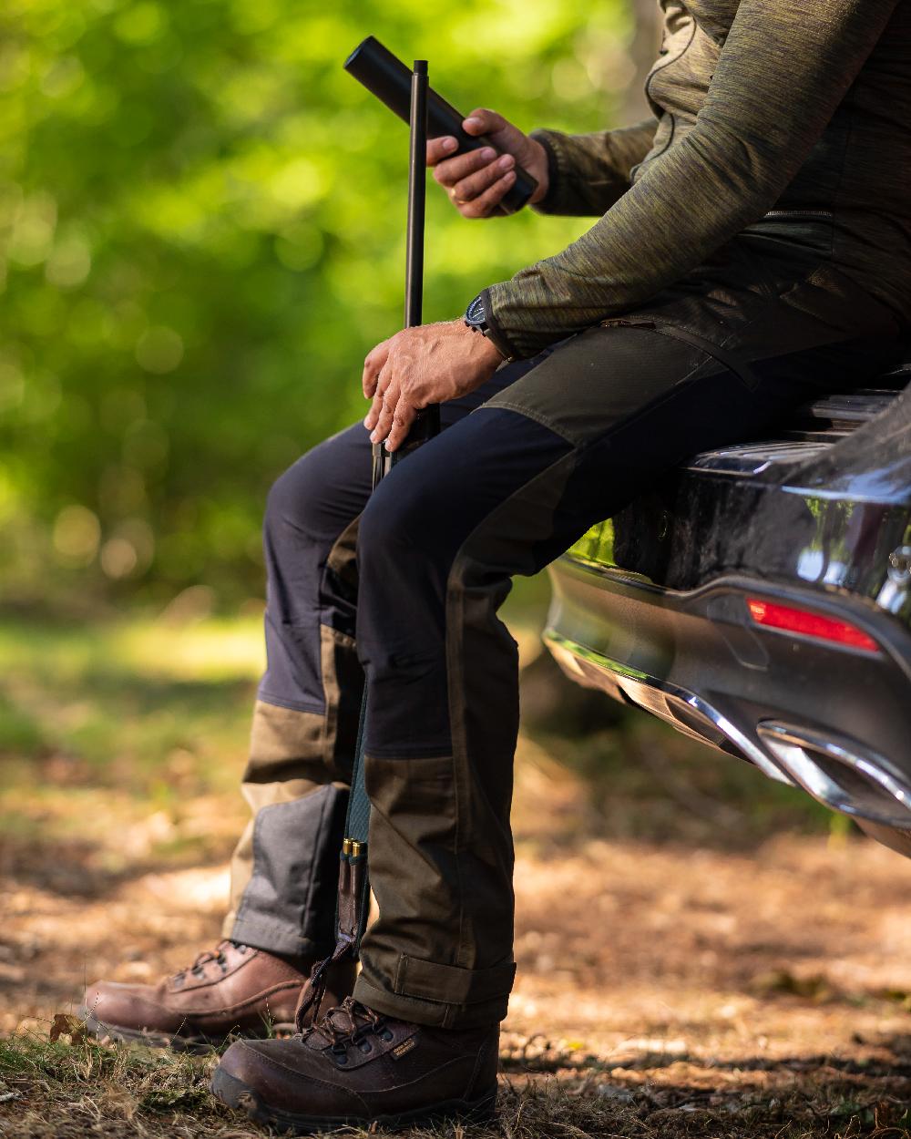 Adventure Green Coloured Deerhunter Rogaland Contrast Stretch Trousers on car background #colour_adventure-green