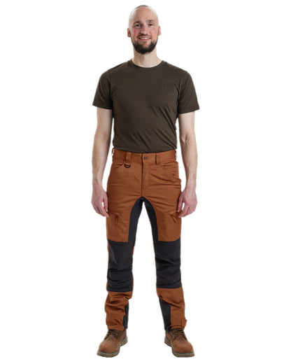 Burnt Orange Coloured Deerhunter Rogaland Contrast Stretch Trousers on white background #colour_burnt-orange