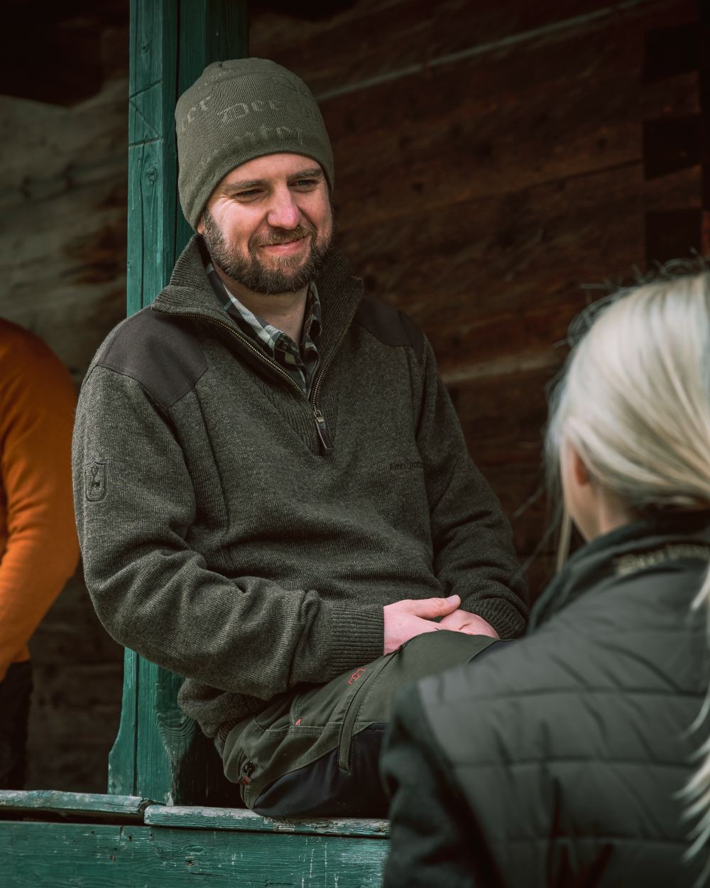 Dark Elm coloured Deerhunter Sheffield Zip Neck Sweater on house background #colour_dark-elm