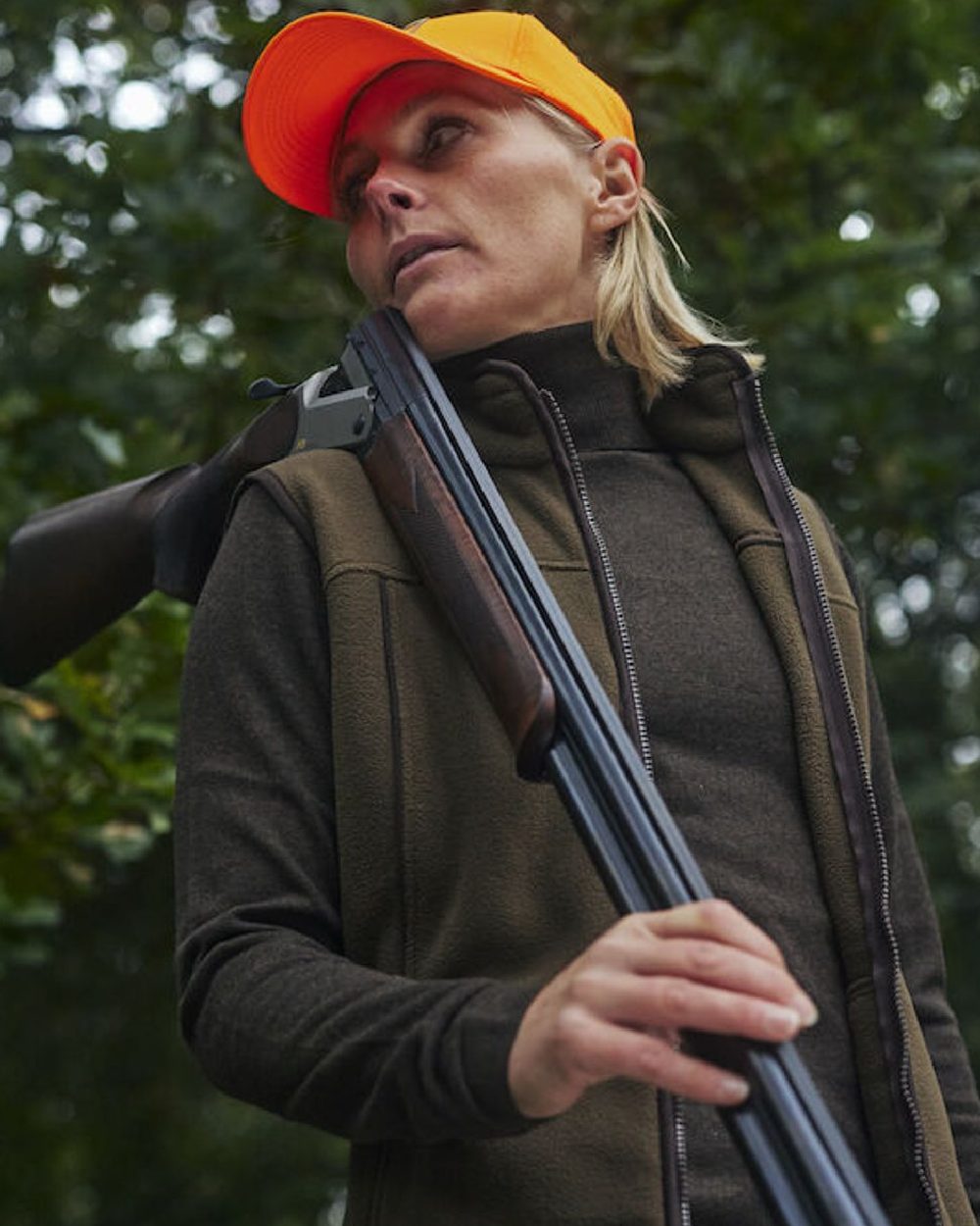 Orange coloured Deerhunter Shield Cap on forest background #colour_orange