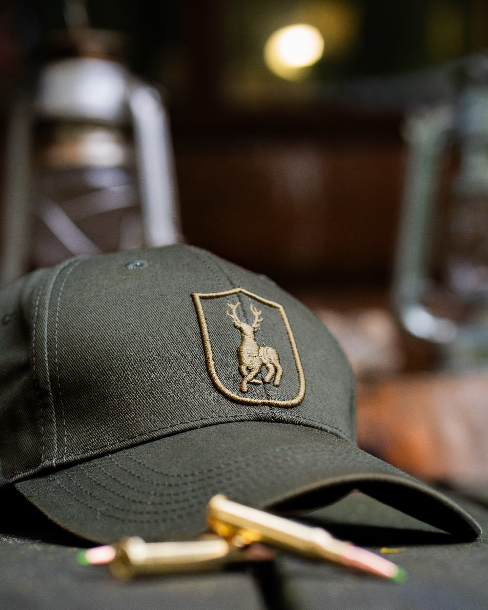 Timber coloured Deerhunter Shield Cap on blurry background #colour_timber