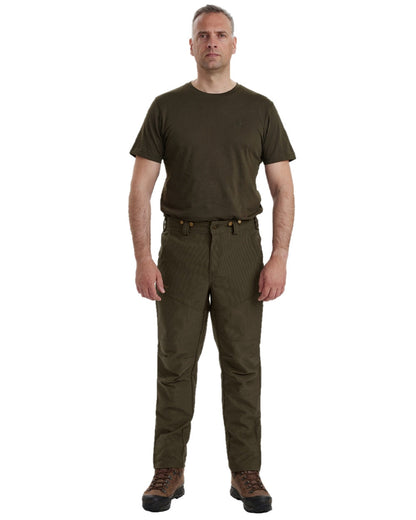 Palm Green coloured Deerhunter Strike Extreme Boot Trousers on white background #colour_palm-green