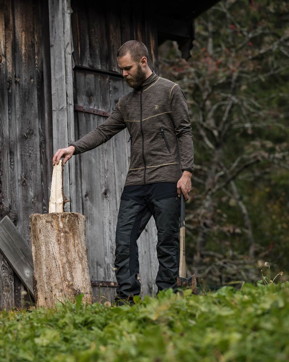 Black Ink coloured Deerhunter Strike Trousers on forest background #colour_black-ink