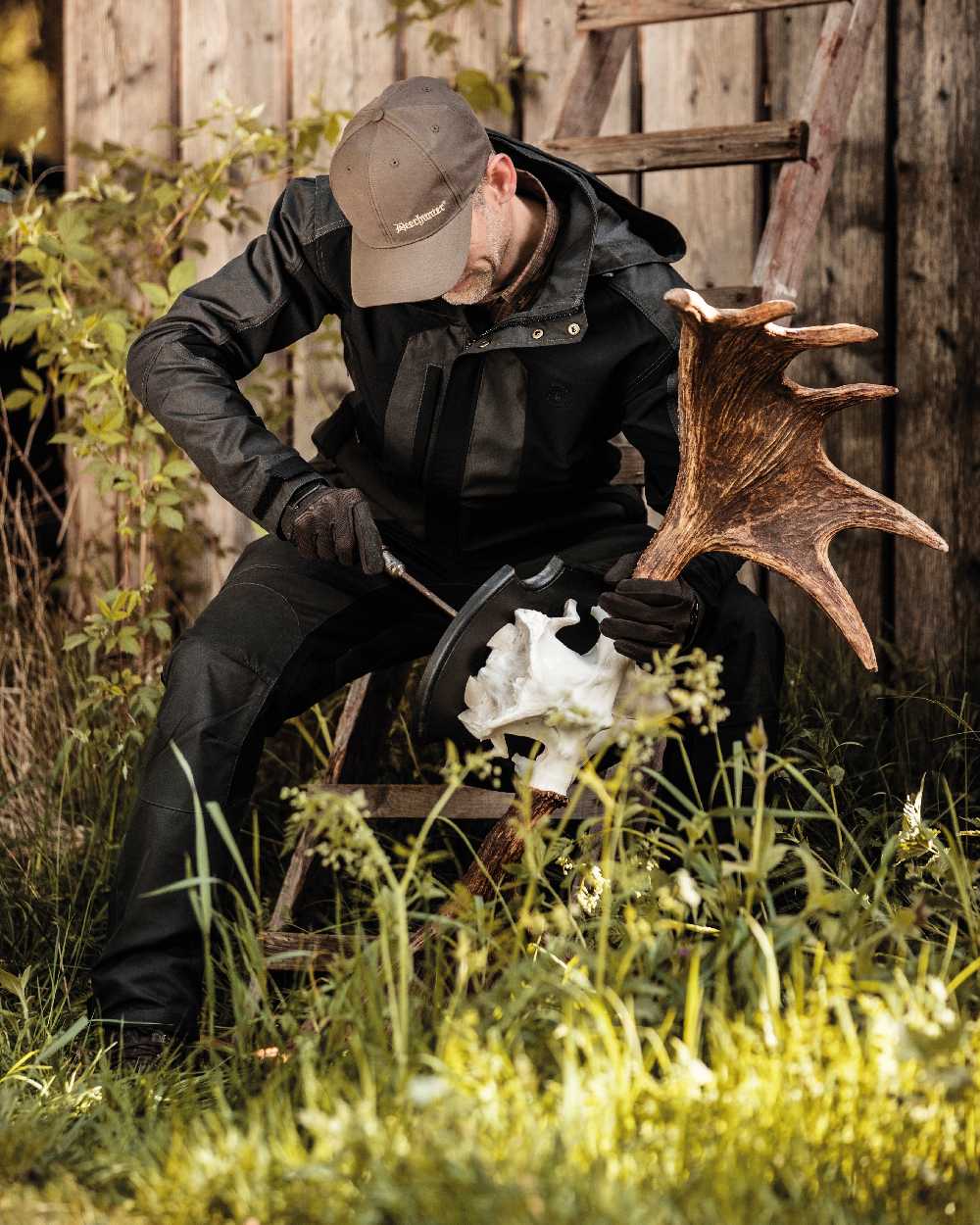 Black Ink coloured Deerhunter Strike Trousers on forest background #colour_black-ink