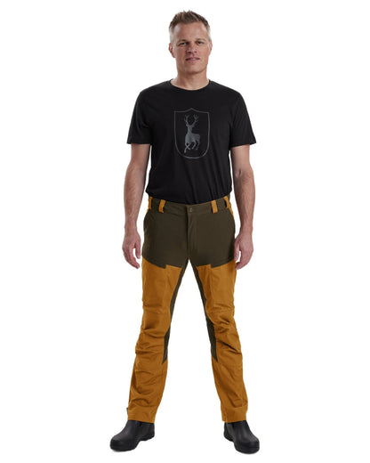Bronze coloured Deerhunter Strike Trousers on white background #colour_bronze