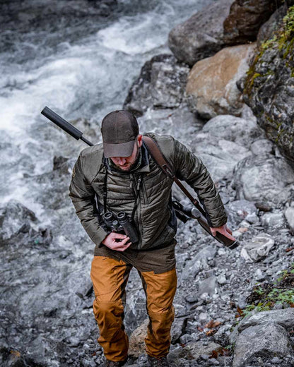 Bronze coloured Deerhunter Strike Trousers on waterfall background #colour_bronze