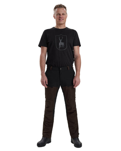 Dark Prune coloured Deerhunter Strike Trousers on white background #colour_dark-prune
