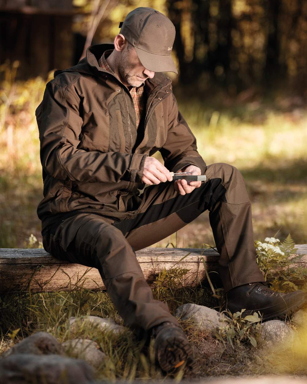Fallen Leaf coloured Deerhunter Strike Trousers on forest background #colour_fallen-leaf