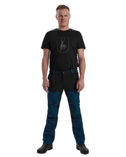 Pacific Blue coloured Deerhunter Strike Trousers on white background #colour_pacific-blue