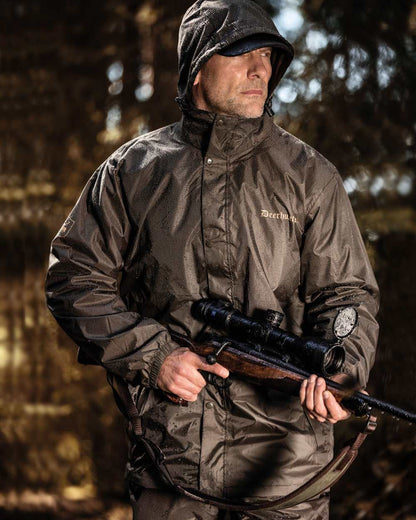 Timber coloured Deerhunter Survivor Packable Rain Jacket on forest background #colour_timber