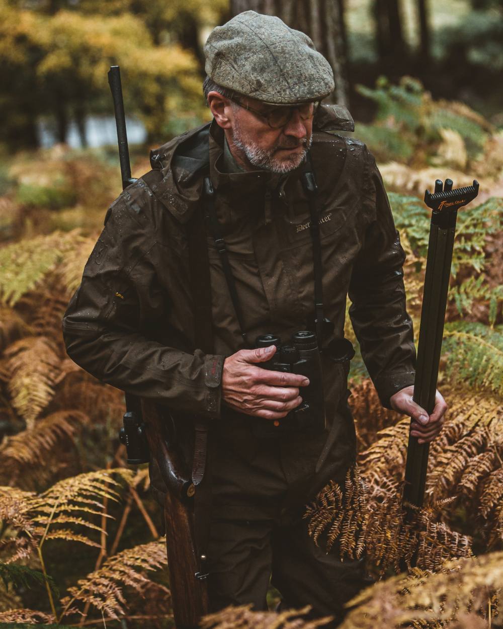 Canteen coloured Deerhunter Track Rain Jacket on forest background #colour_canteen