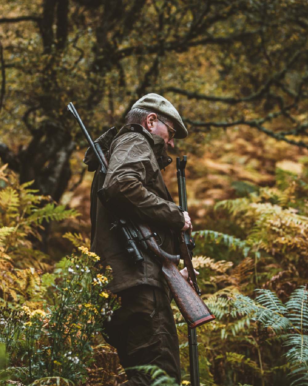 Canteen coloured Deerhunter Track Rain Jacket on forest background #colour_canteen