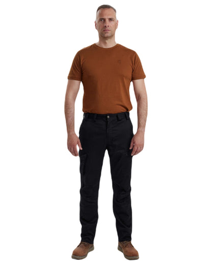Black coloured Deerhunter Traveler Trousers on white background #colour_black