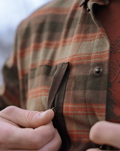 Autumn Orange Check coloured Harkila Aivak Long Sleeved Shirt on forest background #colour_autumn-orange-check