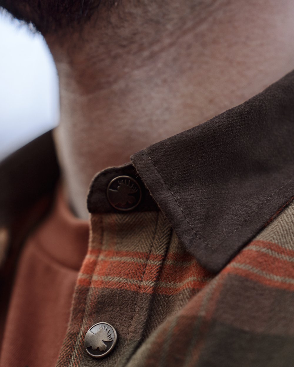 Autumn Orange Check coloured Harkila Aivak Long Sleeved Shirt on forest background #colour_autumn-orange-check