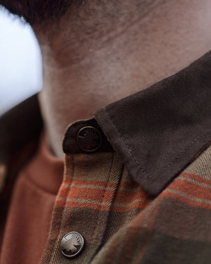 Autumn Orange Check coloured Harkila Aivak Long Sleeved Shirt on forest background #colour_autumn-orange-check