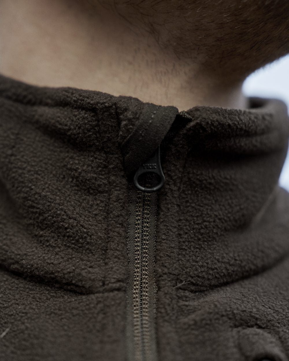 Shadow Brown Coloured Harkila Aspire Fleece Waistcoat on outdoor background #colour_shadow-brown