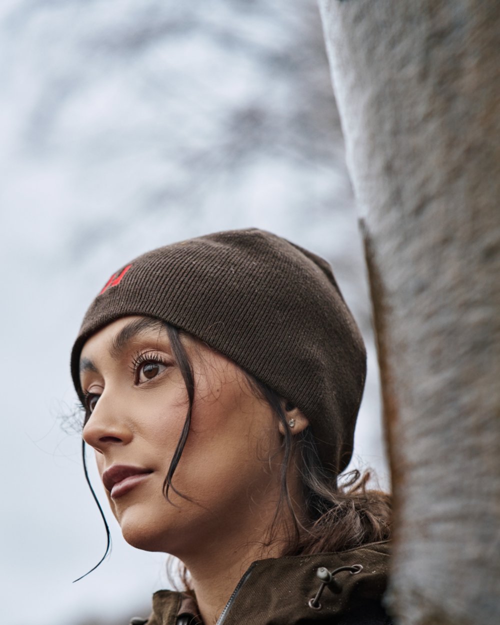 Shadow Brown Red Coloured Harkila Aspire Reversible Beanie on outdoor background #colour_shadow-brown-red