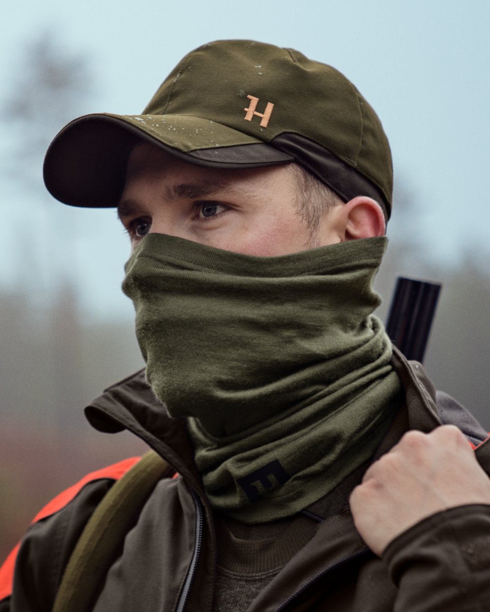 Dark Olive Coloured Harkila Base All Season Tubular Limited Edition on outdoor background #colour_dark-olive