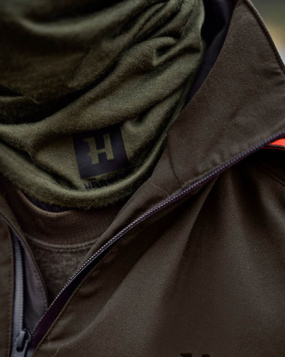 Dark Olive Coloured Harkila Base All Season Tubular Limited Edition on outdoor background #colour_dark-olive