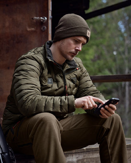 Willow Green Coloured Harkila Clim8 Insulated Jacket on outdoor background #colour_willow-green