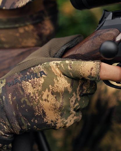 AXIS Forest coloured Harkila Deer Stalker Camo Mesh Gloves on blurry background #colour_axis-forest