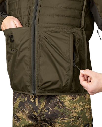 Willow Green AXIS Forest Coloured Harkila Deer Stalker Camo Reversible Packable Waistcoat on white background #colour_willow-green-axis-forest