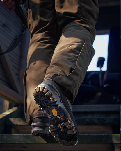 Dark Brown Coloured Harkila Driven Hunt 2.0 GTX Boots on outdoor background #colour_dark-brown