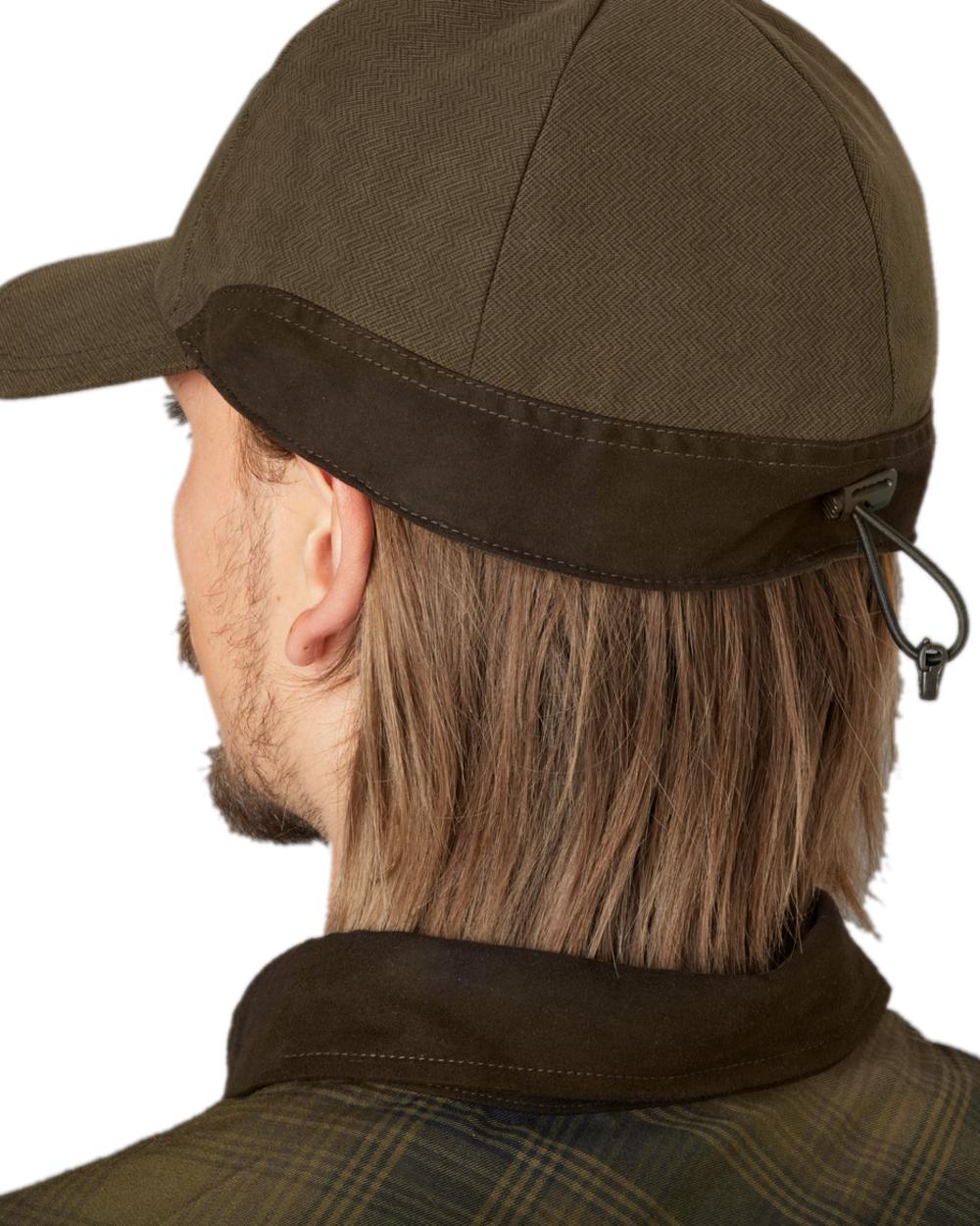 Willow Green Coloured Harkila Driven Hunt HSP Insulated Cap on white background #colour_willow-green