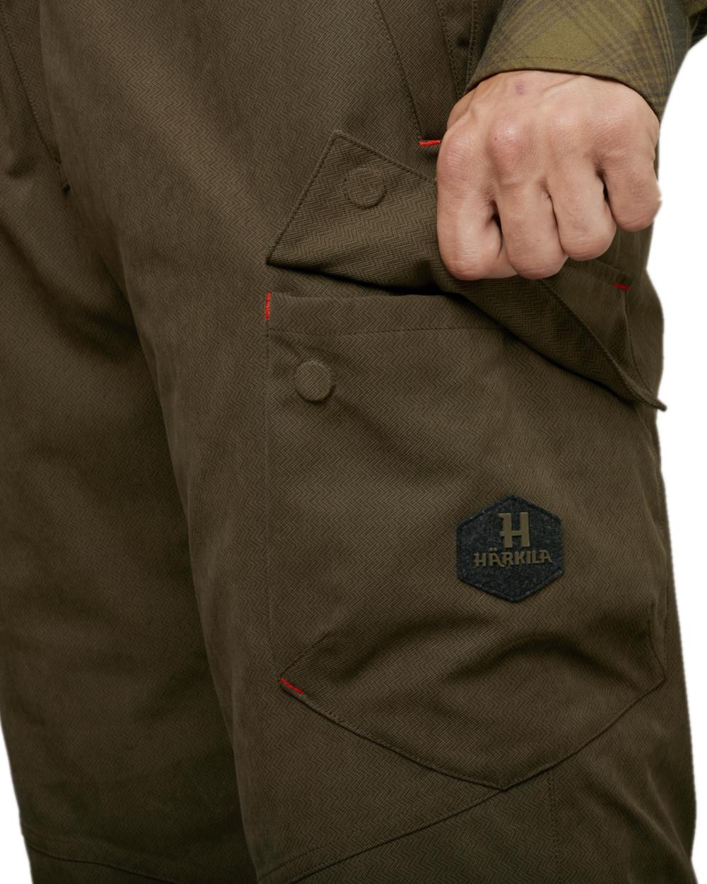 Willow Green Coloured Harkila Driven Hunt HWS Insulated Trousers on white background #colour_willow-green