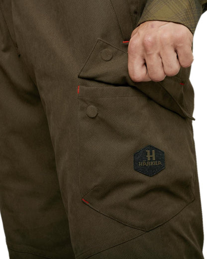 Willow Green Coloured Harkila Driven Hunt HWS Insulated Trousers on white background #colour_willow-green
