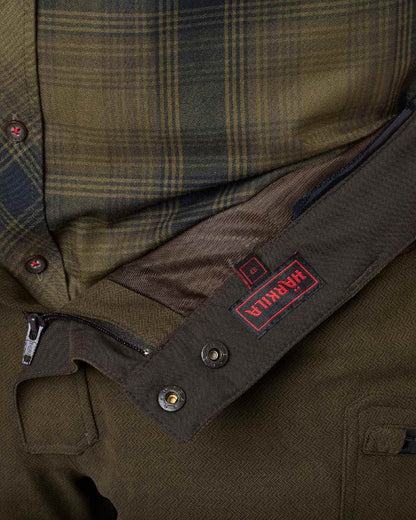Willow Green Shadow Brown Coloured Harkila Driven Hunt HWS Leather Trousers on white background #colour_willow-green-shadow-brown