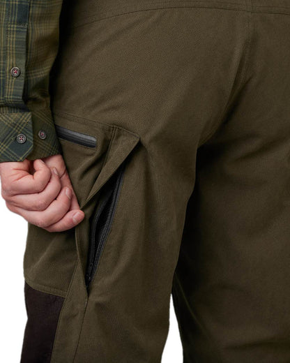 Willow Green Shadow Brown Coloured Harkila Driven Hunt HWS Leather Trousers on white background #colour_willow-green-shadow-brown